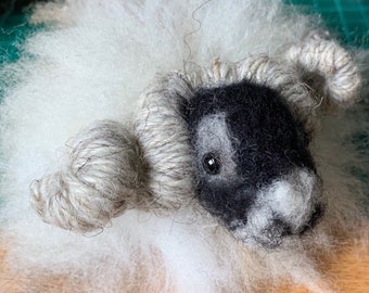 A wee sheep, needle felted sheep