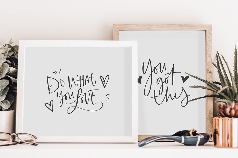 May include: Two framed prints with motivational quotes. The left print says "Do what you love" with a heart symbol. The right print says "You got this" with a heart symbol.