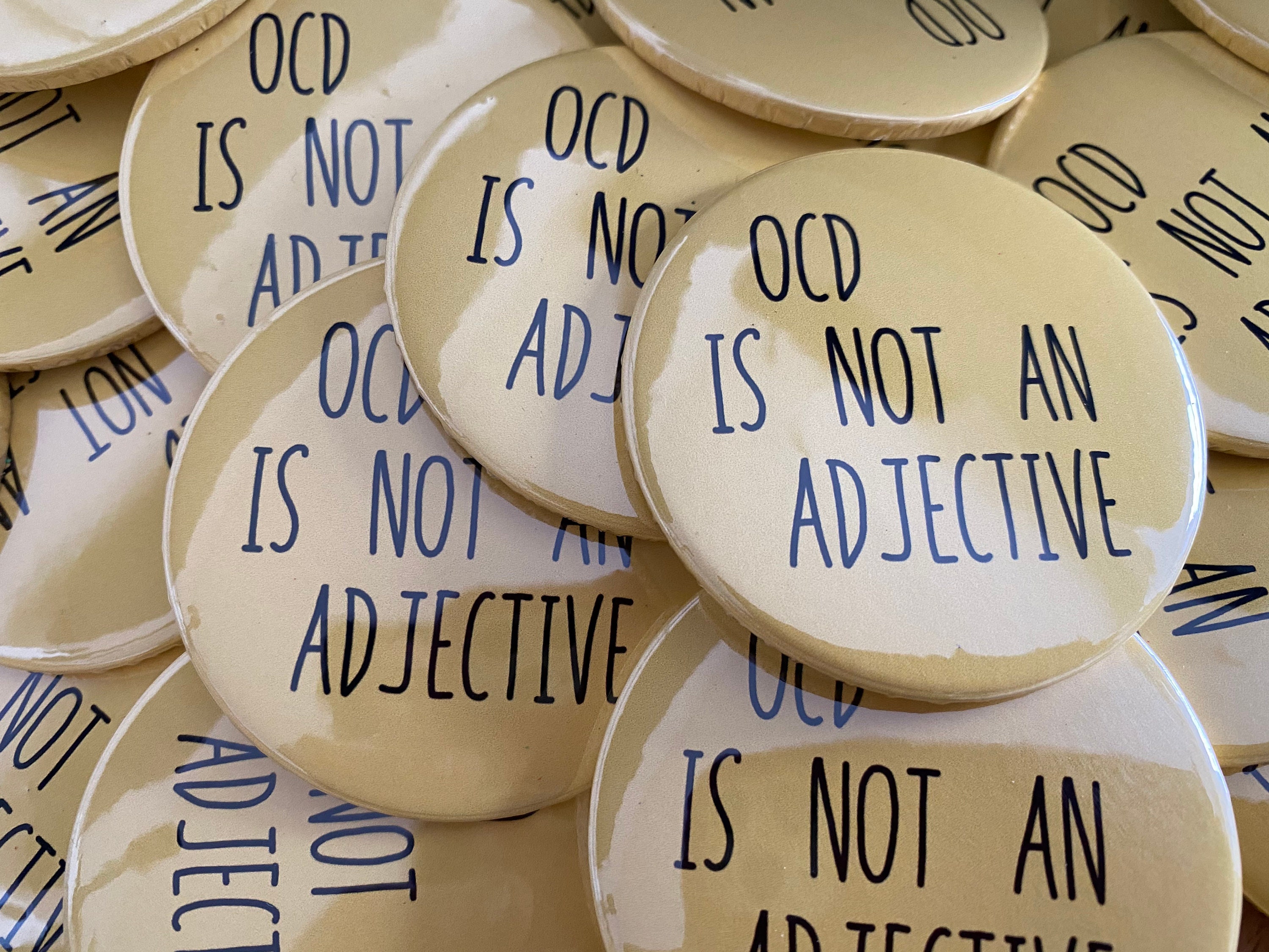 ocd-advocacy-badge-ocd-is-not-an-adjective-etsy