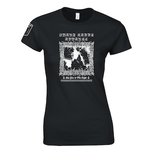 May include: Black women's t-shirt featuring a white graphic print of a band logo. The logo reads "Svarte Krigere" and "Aphyxia". The text "The Fire is My Light" is printed below the logo.