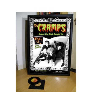 THE CRAMPS songs the lord taught us promotional poster,garage,goth,punk,stay sick,gravest hits,psychedelic jungle,a date with elvis