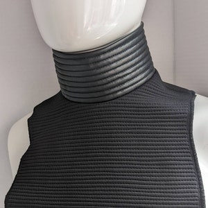 Tanktrooper Neckseal screen accurate zipper fastening black horizontal stitched ribbed bib.