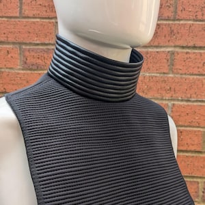 Tanktrooper Neckseal screen accurate zipper fastening black horizontal stitched ribbed bib.