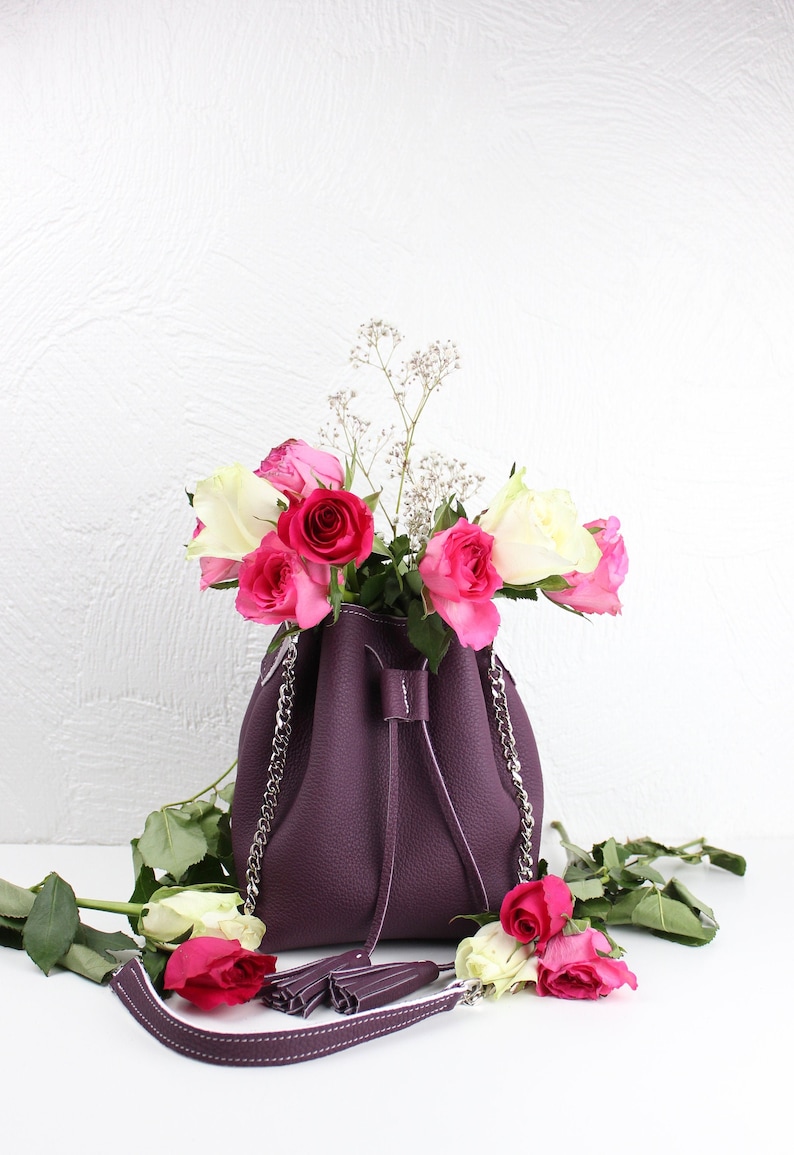 small pom poms chain strap and cord closure handmade, Small bucket bag in real purple grained leather