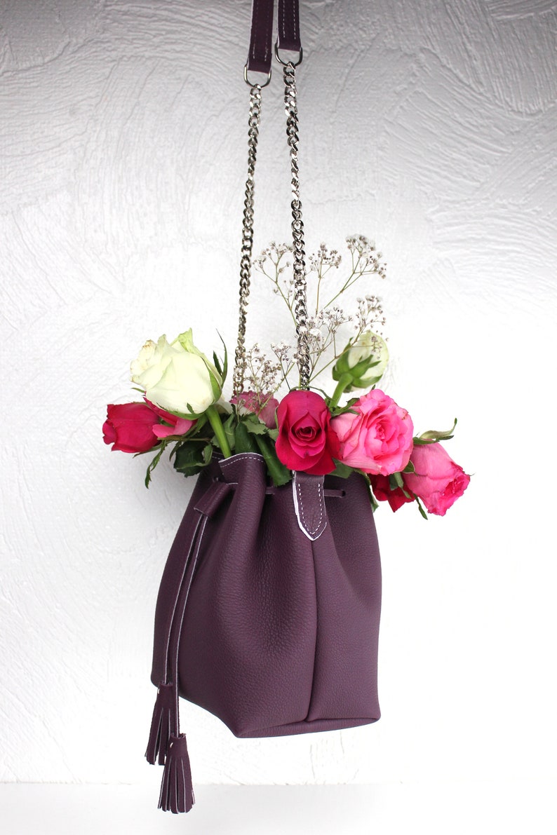 small pom poms chain strap and cord closure handmade, Small bucket bag in real purple grained leather