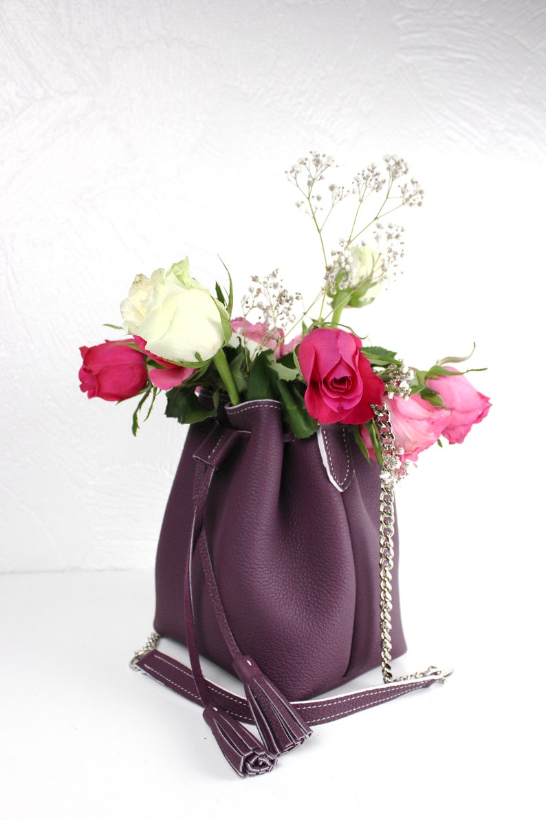 small pom poms chain strap and cord closure handmade, Small bucket bag in real purple grained leather