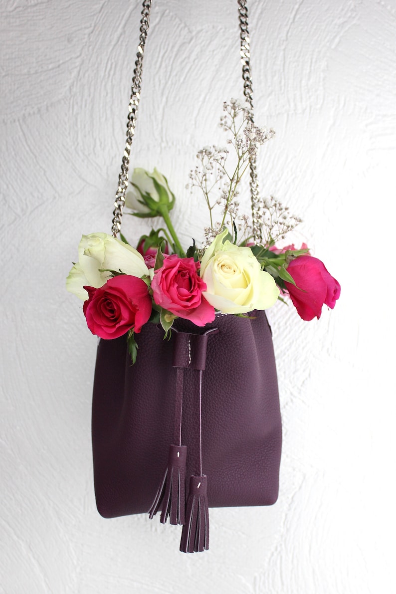 small pom poms chain strap and cord closure handmade, Small bucket bag in real purple grained leather