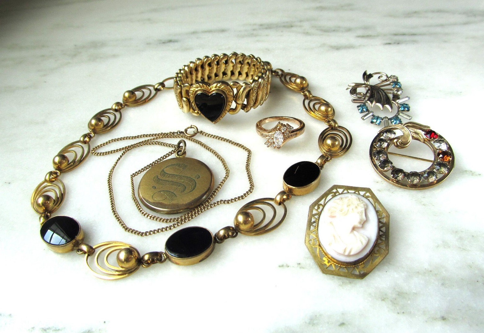 Antique, vintage, designer costume jewelry, fine precious Jewellery.