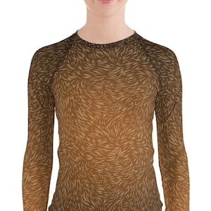 May include: A long-sleeved shirt with a brown and tan abstract pattern. The shirt has a crew neck and a fitted silhouette.