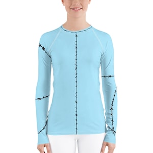 Sally Stitch långärmad rashguard: Ljusblå löpardräkt