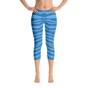 May include: Blue and white striped leggings with a zebra print pattern.