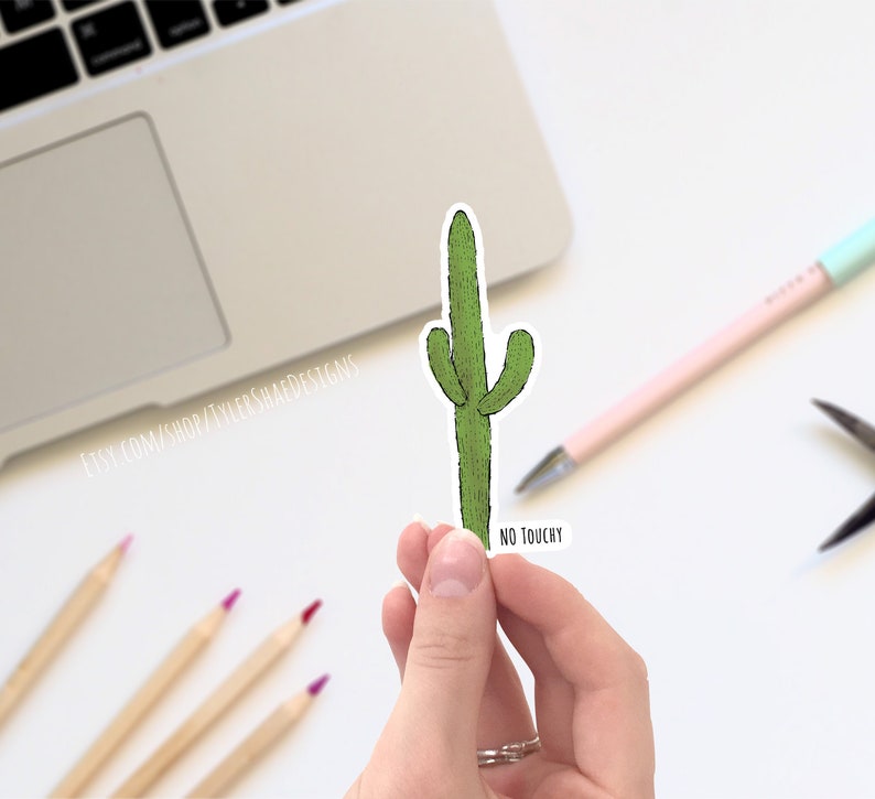 May include: A green cactus sticker with the text "NO TOUCHY" on a white background.