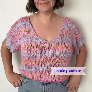 May include: A short-sleeved, V-neck knit top with horizontal stripes in pink, orange, and light blue. The top has a loose fit and is made of a soft, textured yarn. The text "knitting pattern" is displayed on a white banner.