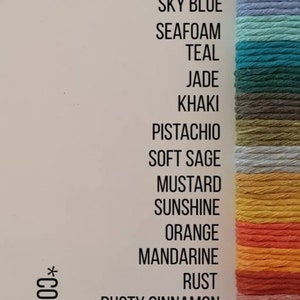 May include: A color chart of 28 different colors of cotton cord, with the color names listed next to each color. The colors range from natural to lavender. The text "*COLOURS MAY VARY DEPENDING ON SCREEN SETTINGS*" is written vertically on the left side of the chart.