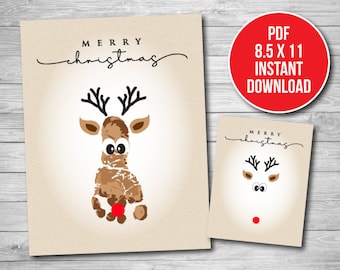 May include: Printable Christmas card featuring a reindeer made with handprints. The card says "Merry Christmas" in a cursive font.