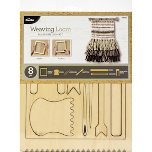 May include: A Bucilla Weaving Loom All-in-One Kit. The kit includes a small loom, comb, needles, shuttle, shed, hanger, and pom-pom tool. The packaging features a woven sample with brown and beige fringe. The kit contains 8 pieces.