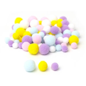 May include: A collection of colorful pom-poms in various sizes and pastel colors, including yellow, purple, pink, blue, and white. The pom-poms are made of a soft, fuzzy material and are scattered on a white background. Ideal for craft projects.