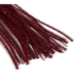 May include: A bundle of red pipe cleaners with a glittery, textured surface. These craft supplies are arranged against a white background, showcasing their vibrant color and flexible form. Ideal for various DIY projects and crafts.