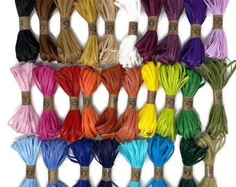 May include: Assortment of 24 spools of paper cord in various colors, including black, brown, beige, white, purple, green, pink, red, orange, yellow, blue, and teal. Each spool is tied with a brown ribbon and has a label that reads "Handmade with Love".