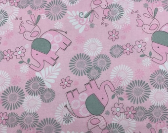 700 Flannel fabric pink background with pink and gray elephants birds flowers leaves and hearts sold by the yard.