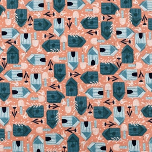 668 COTTON fabric peach background with tossed teal & blue bird houses mushrooms birds flowers and dots sold by the yard.