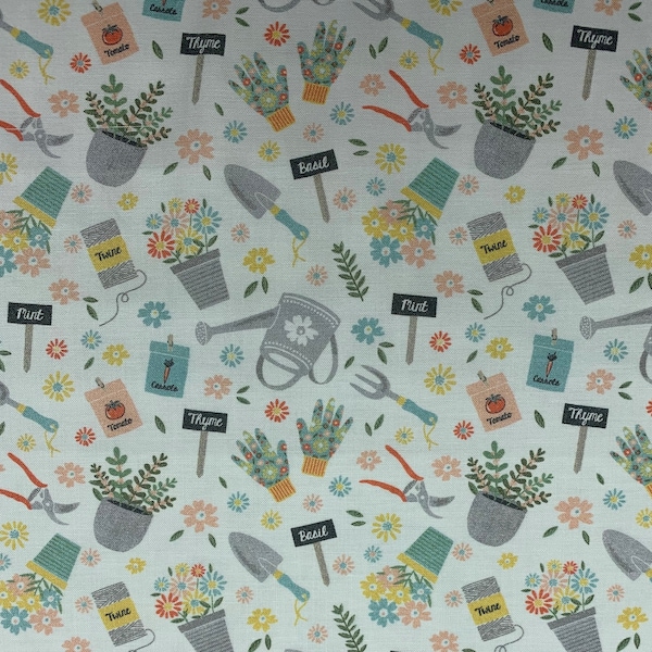 328 COTTON fabric white background with tossed garden tools watering cans flowers pots seed packets & gloves sold by the yard.