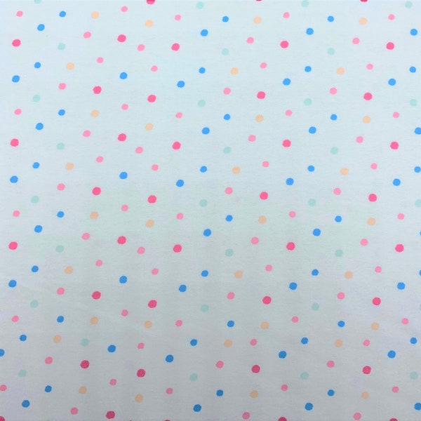 862 Flannel fabric white background with pastel pink blue yellow peach mint green polka dots sold by the yard.