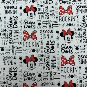395 COTTON fabric white background with Minnie Mouse faces & red bows with white dots and words sold by the yard.