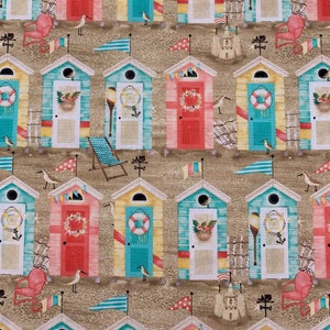 415 COTTON fabric sand background with rows of beach huts chairs & sand castles sold by the yard.