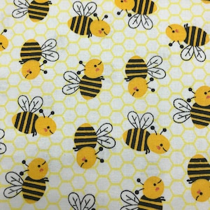 109 COTTON fabric white with yellow honeycomb background and tossed bumble bees sold by the yard