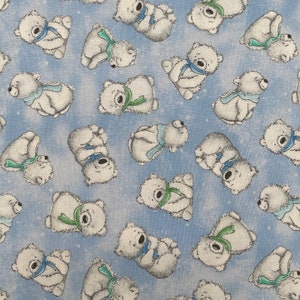 570 COTTON fabric Artic Nights light blue with tossed polar bears sold by the yard.