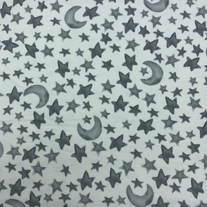 582 Flannel fabric Celeste Swan white with gray half moon and stars sold by the yard. Coordinating fabric numbers 578, 579, 5800, 581