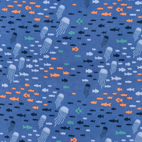 921 Flannel fabric blue water background with jellyfish light blue orange & navy fish swimming sold by the yard.