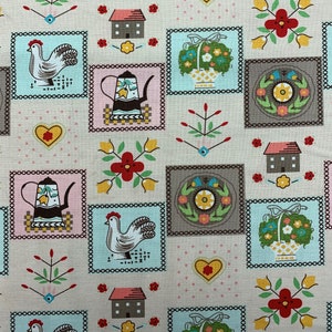 May include: A beige fabric with a repeating pattern of various images. The images include a teapot, a chicken, a flower, a house, and a basket of flowers. The images are surrounded by a decorative border.