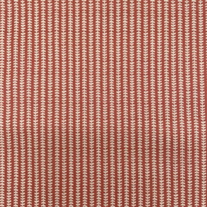 May include: Red fabric with a white repeating pattern of small leaves in vertical lines.