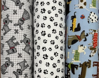 1371-1373 Flannel fabric different breeds of dogs & paw prints by AE Nathan collections sold by the yard.