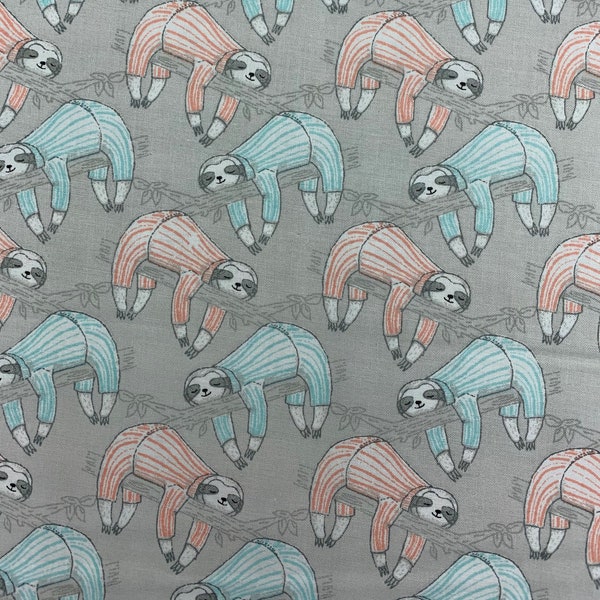 361 COTTON fabric light gray background with baby sloths in peach & mint stripe pajamas hanging on branches sold by the yard.