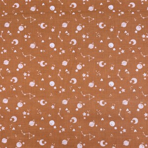 707 COTTON fabric rusty orange background with white planets & star galaxy sold by the yard.