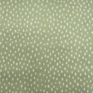 May include: A green fabric with a white polka dot pattern.