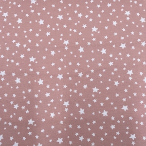 1152 Flannel fabric rose pink background with white stars sold by the yard.