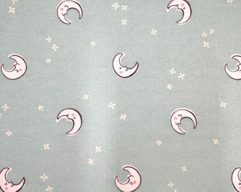 1232 Flannel fabric light mint green background with tossed white crescent moons & stars sold by the yard