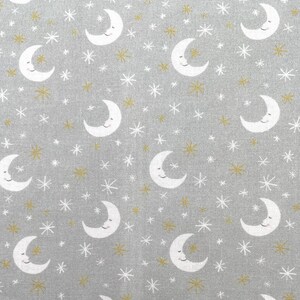 749 COTTON fabric gray with white crescent moons white & gold stars sold by the yard.