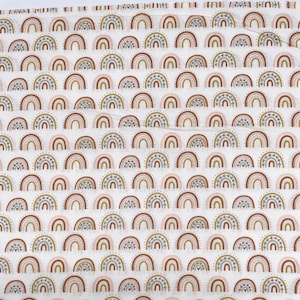 706 COTTON fabric white with rows of boho rainbows sold by the yard.
