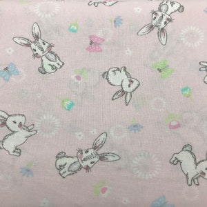 51 COTTON fabric pink with tossed white bunnies butterflies flowers sold by the yard.