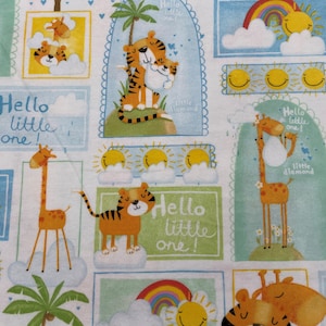 May include: A white fabric with a repeating pattern of colorful animals and text. The animals include a tiger, a giraffe, and a sun. The text says "Hello little one!" and "Little Diamond".