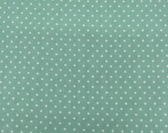 1090 Flannel fabric mint green background with little white polka dots sold by the yard.