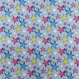 626 COTTON fabric blue background with multi color & size stars sold by the yard.