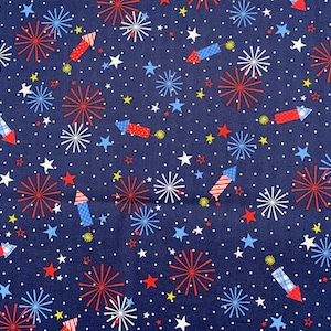 504 COTTON fabric navy blue background with tossed fireworks & stars sold by the yard.