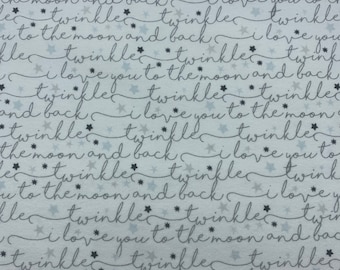 513 Flannel fabric white with words written in cursive in rows and stars sold by the yard.