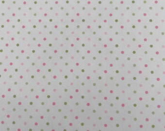 979 Flannel fabric white background with shades of yellow, and green polka dots sold by the yard.